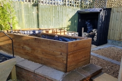 Vegetable planter and log store